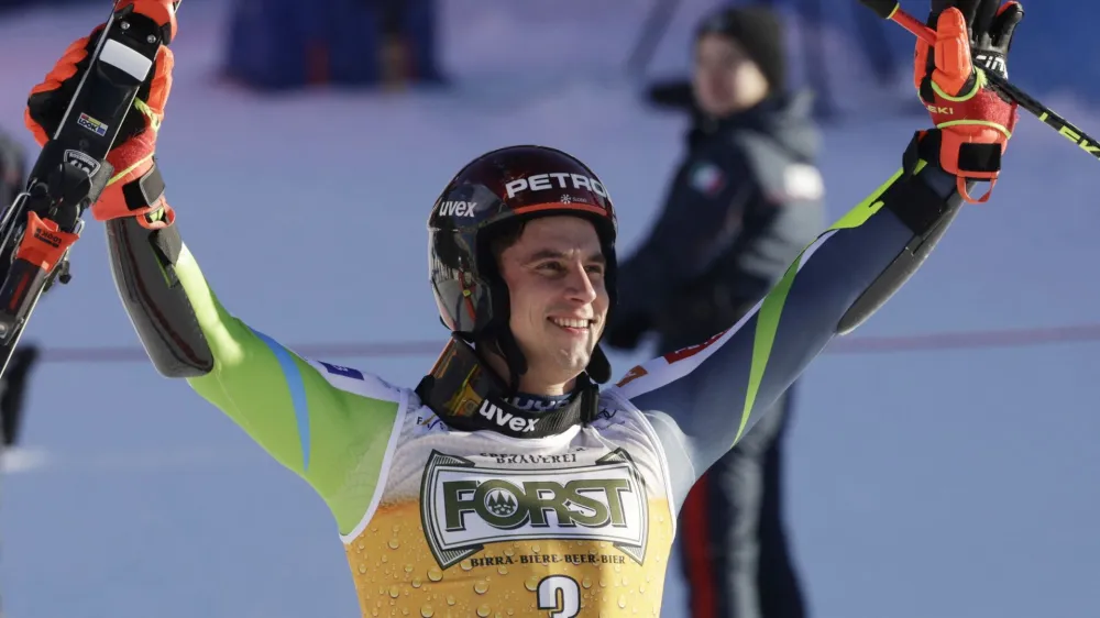 Alpine Skiing - FIS Alpine Ski World Cup - Men's Giant Slalom - Alta Badia, Italy - December 17, 2023 Slovenia's Zan Kranjec celebrates after finishing third in the men's giant slalom REUTERS/Leonhard Foeger