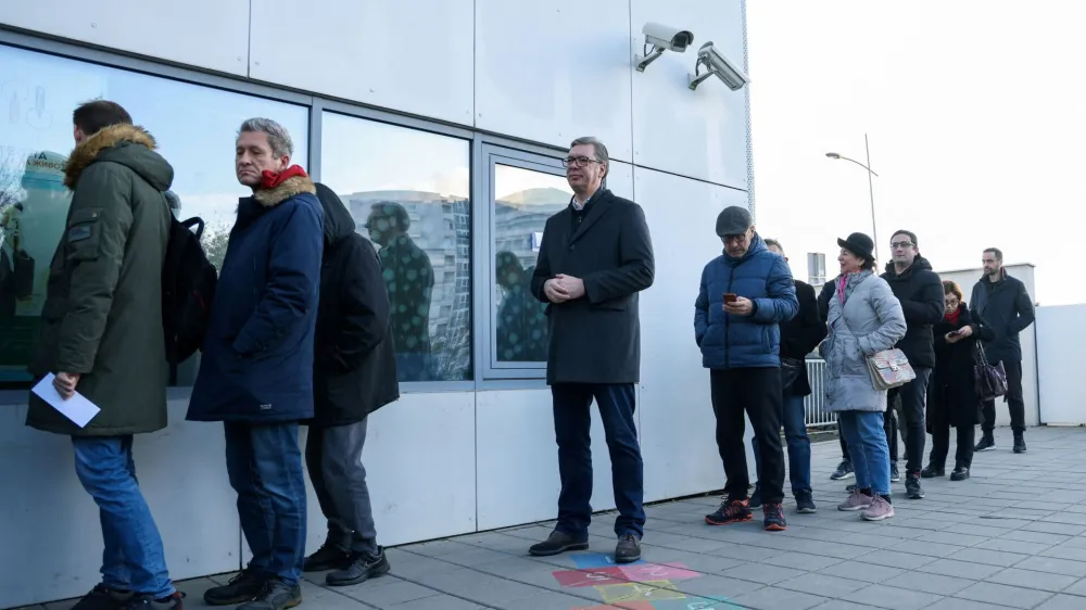 Serbian President Aleksandar Vucic waits in a queue to cast his vote at a polling station during the parliamentary election in Belgrade, Serbia, December 17, 2023. REUTERS/Zorana Jevtic REFILE - QUALITY REPEAT