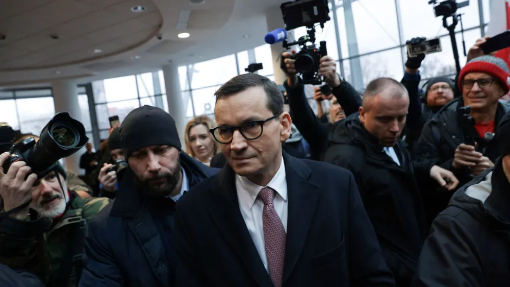 Former Polish Prime Minister Mateusz Morawiecki attends gathering of protesters and Law and Justice politicians after the management of Polish public television, radio and news agency PAP have been dismissed by the culture minister, at the broadcaster's headquarters in Warsaw, Poland, December 20, 2023. Dawid Zuchowicz/Agencja Wyborcza.pl via REUTERS ATTENTION EDITORS - THIS IMAGE WAS PROVIDED BY A THIRD PARTY. POLAND OUT. NO COMMERCIAL OR EDITORIAL SALES IN POLAND.