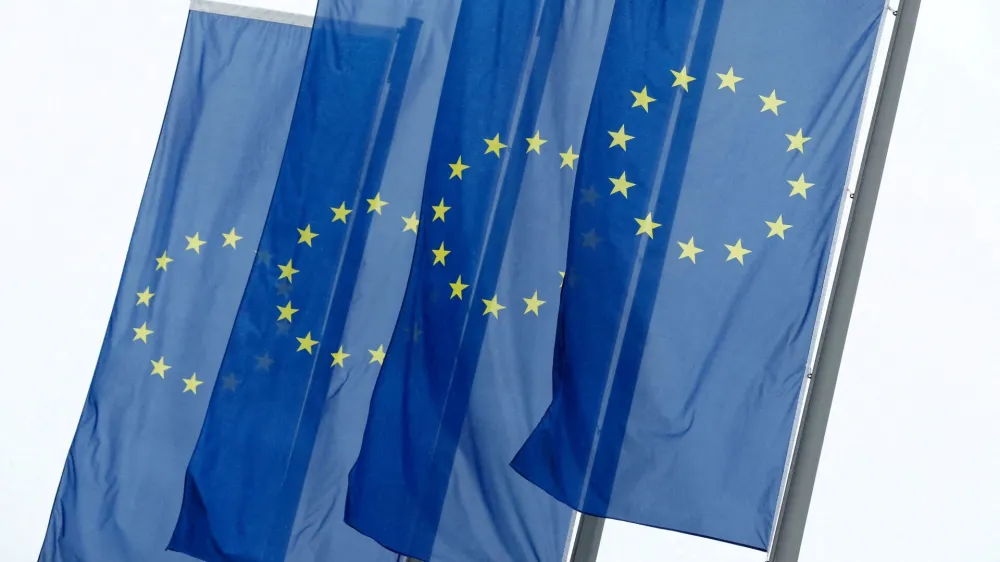 FILE PHOTO: European Union (EU) flags fly in front of the headquarters of the European Central Bank (ECB) in Frankfurt, Germany, July 8, 2020. REUTERS/Ralph Orlowski/File Photo