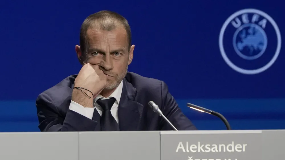 FILE - President of UEFA Aleksander Ceferin listens to questions during a news conference, after being reelected, at the end of the 47th ordinary UEFA congress in Lisbon, Wednesday, April 5, 2023. The European Union's top court has ruled UEFA and FIFA acted contrary to competition law by blocking plans for the breakaway Super League. The case was heard last year at the Court of Justice after Super League failed at launch in April 2021. UEFA President Aleksander Ceferin called the club leaders "snakes" and "liars." (AP Photo/Armando Franca, File)