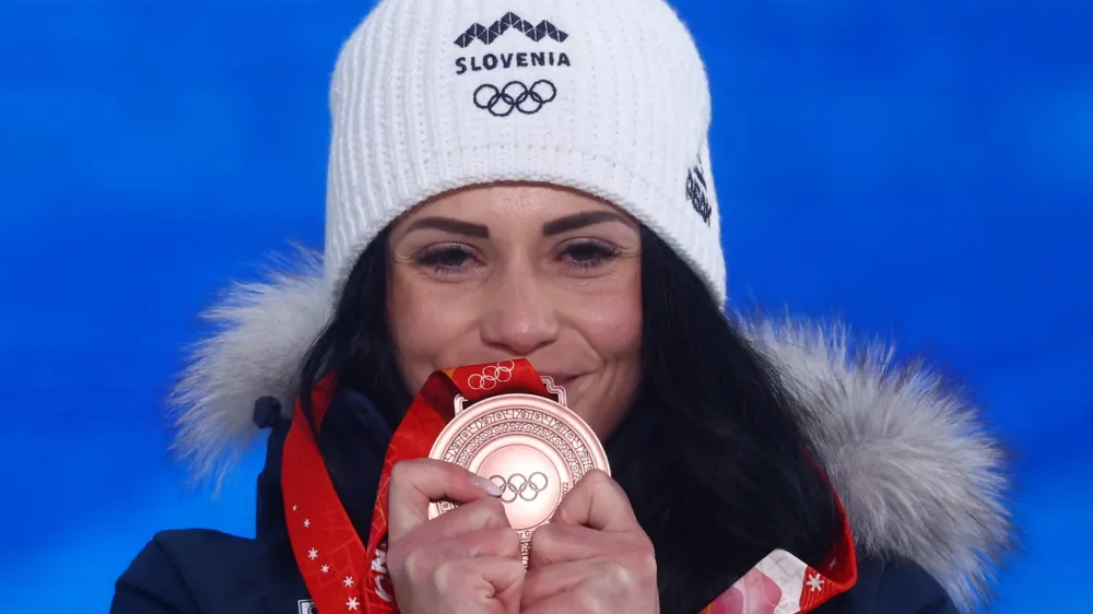 ﻿2022 Beijing Olympics - Victory Ceremony - Snowboard - Women's Parallel Giant Slalom - Zhangjiakou Medals Plaza, Zhangjiakou, China - February 8, 2022. Bronze medallist Gloria Kotnik of Slovenia poses with her medal during the victory ceremony. REUTERS/Kai Pfaffenbach