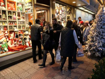 Iranian people look at a showcase of a Christmas store in Tehran, Iran December 25, 2023. Majid Asgaripour/WANA (West Asia News Agency) via REUTERS ATTENTION EDITORS - THIS IMAGE HAS BEEN SUPPLIED BY A THIRD PARTY.