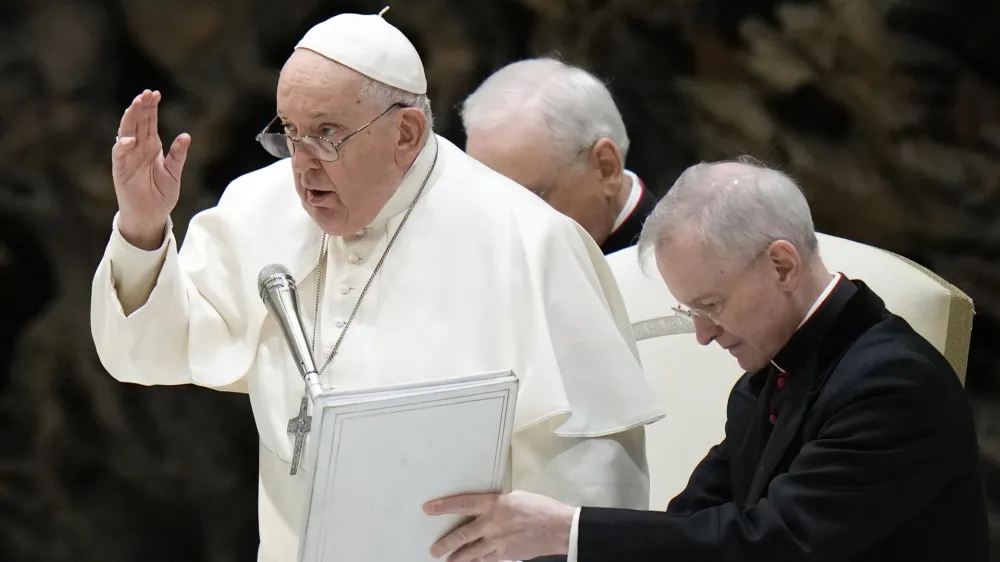 Pope Francis delivers his blessing at the end of his weekly general audience in the Paul VI Hall, at the Vatican, Wednesday, Dec. 27, 2023. (AP Photo/Alessandra Tarantino)
