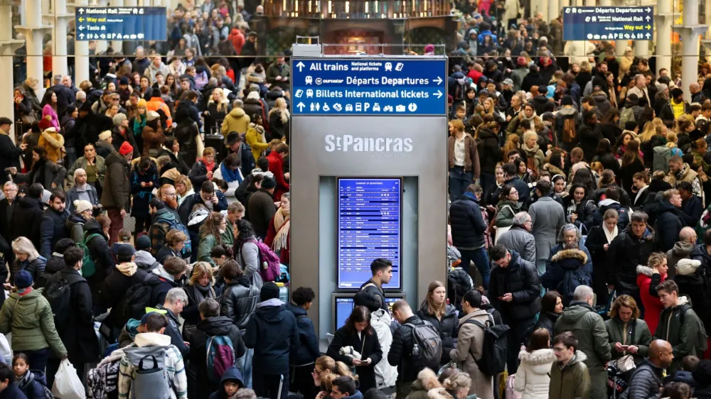 Passengers gather at the departure gates of the Eurostar terminal at St Pancras International Station after the services are cancelled due to a flooded tunnel, in London, Britain, December 30, 2023. REUTERS/Belinda Jiao