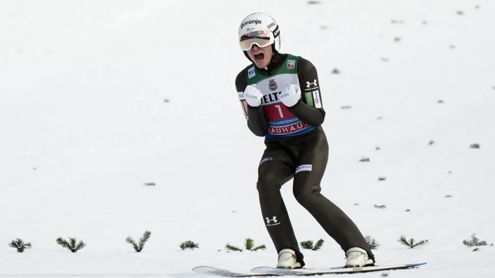 Anze Lanisek, of Slovenia, reacts after his second round jump at the second stage of the 72th Four Hills ski jumping tournament in Garmisch-Partenkirchen, Germany, Monday, Jan. 1, 2024. (AP Photo/Matthias Schrader)