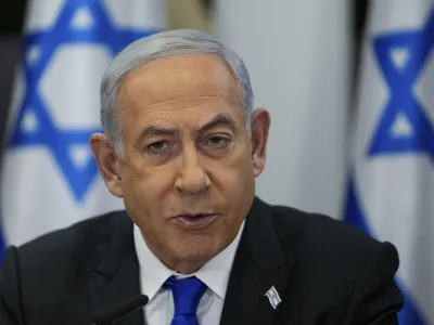 FILE - Israeli Prime Minister Benjamin Netanyahu chairs a cabinet meeting at the Kirya military base, which houses the Israeli Ministry of Defence, in Tel Aviv, Israel, Sunday, Dec. 24, 2023. Israel's Supreme Court on Monday, Jan. 1, 2024, struck down a key component of Netanyahu's contentious judicial overhaul, a decision that threatens to reopen the fissures in Israeli society that preceded the country's ongoing war against Hamas.(AP Photo/Ohad Zwigenberg, Pool, File)