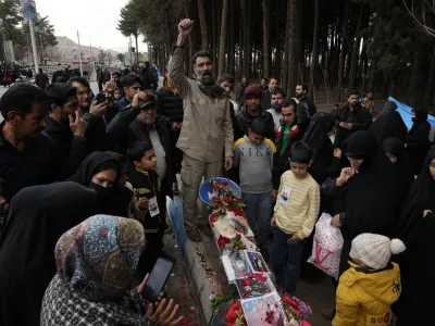 People chant slogans at the scene of Wednesday's bomb explosion in the city of Kerman, about 510 miles (820 kms) southeast of the capital Tehran, Iran, Thursday, Jan. 4, 2024. Investigators believe suicide bombers likely carried out an attack on a commemoration for an Iranian general slain in a 2020 U.S. drone strike, state media reported Thursday, as Iran grappled with its worst mass-casualty attack in decades and as the wider Mideast remains on edge. (AP Photo/Vahid Salemi)