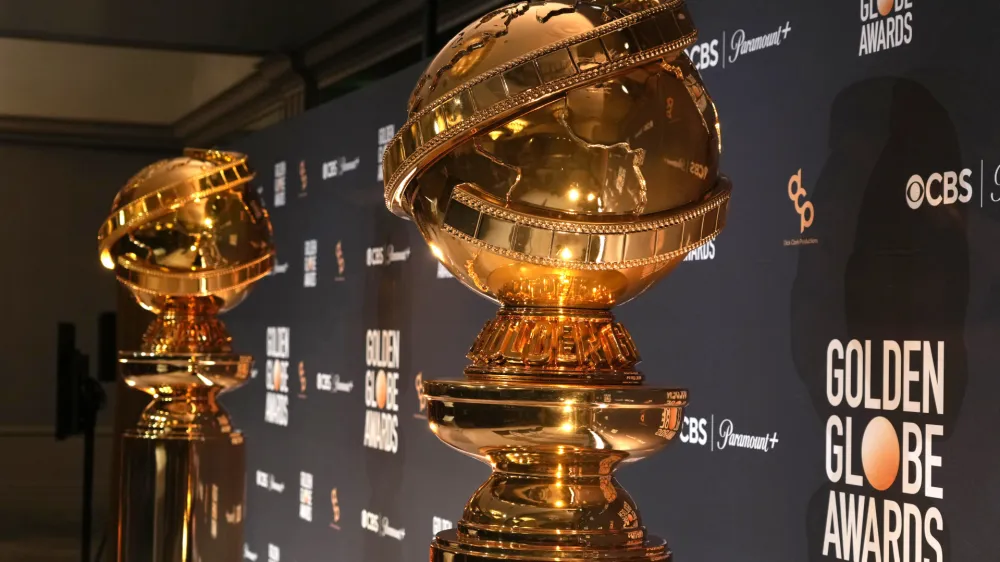 FILE - Replicas of Golden Globe statues appear at the nominations for the 81st Golden Globe Awards at the Beverly Hilton Hotel on Monday, Dec. 11, 2023, in Beverly Hills, Calif. The 81st Golden Globe Awards will be held on Sunday, Jan. 7, 2024. (AP Photo/Chris Pizzello, File)