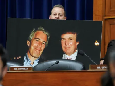 Rep. Jared Moskowitz (D-FL) holds up a photo of former U.S. President Donald Trump with late sex offender Jeffrey Epstein during a meeting of the the House Oversight and Accountability Committee to markup a resolution and report to hold Hunter Biden, President Joe Biden's son, in contempt of Congress, after he refused to appear for a closed-door deposition, at the Capitol in Washington, U.S., January 10, 2024. REUTERS/Kevin Lamarque