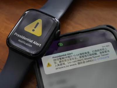 A phone and watch that received an air raid alert is placed together for a photo in New Taipei City, Taiwan Tuesday, Jan. 9, 2024. Taiwan's defense ministry has issued an alert saying China has launched a satellite and urging caution. The Chinese reads ""Air Raid Alert. China at 15:04 launched a satellite, already flown past the southern air space, Citizens to be aware of safety. If any unidentified object is found, alert police and fire fighters to handle. National Defense Ministry." (AP Photo/Ng Han Guan)