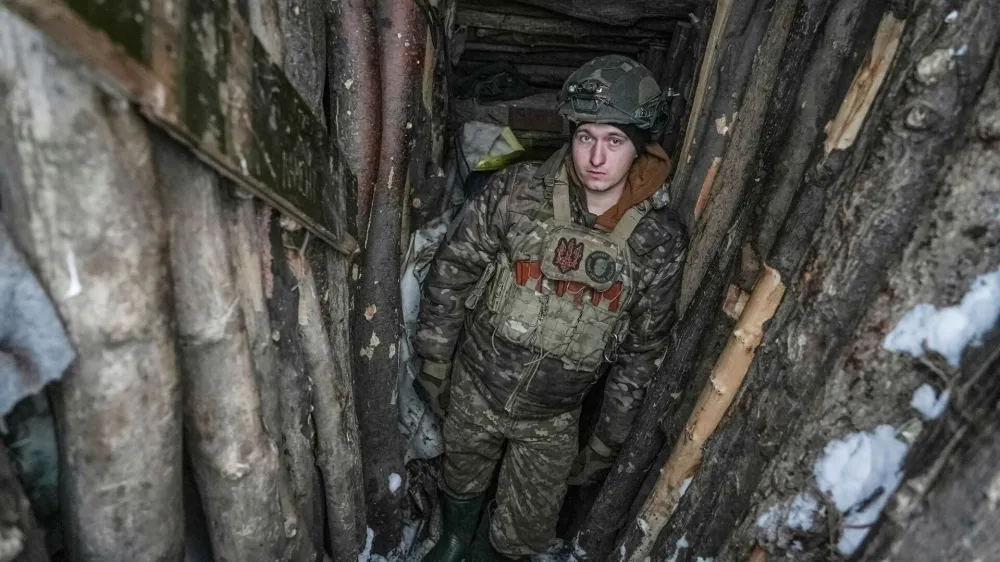 A Ukrainian serviceman of 2 battalion 92nd brigade with the call sign "Myron", 21, is seen inside a dugout, amid Russia's attack on Ukraine, at a position near Bakhmut in Donetsk region, Ukraine January 10, 2024. REUTERS/Inna Varenytsia