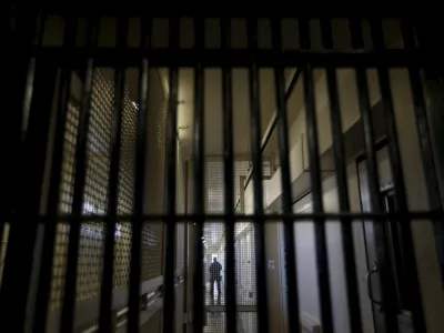 ﻿A guard stands behind bars at the Adjustment Center during a media tour of California's Death Row at San Quentin State Prison in San Quentin, California December 29, 2015. America's most populous state, which has not carried out an execution in a decade, begins 2016 at a pivotal juncture, as legal developments hasten the march toward resuming executions, while opponents seek to end the death penalty at the ballot box. To match Feature CALIFORNIA-DEATH-PENALTY/  Picture taken December 29, 2015. REUTERS/Stephen Lam - RTX21EDY