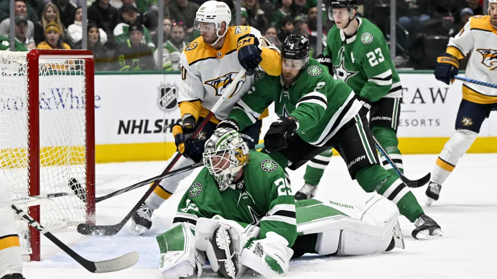 Jan 12, 2024; Dallas, Texas, USA; Dallas Stars goaltender Jake Oettinger (29) gives up a power play goal to Nashville Predators defenseman Roman Josi (not pictured) as center Colton Sissons (10) and defenseman Jani Hakanpaa (2) battle for position during the third period at the American Airlines Center. Mandatory Credit: Jerome Miron-USA TODAY Sports