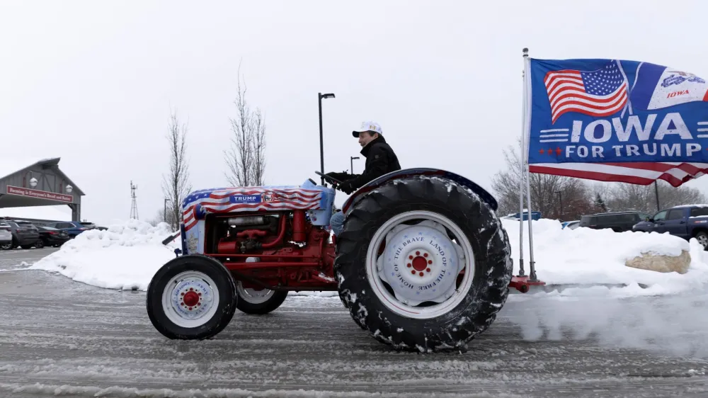Gary Leffler, of West Des Moines, drives his tractor outside of the Machine Shed Restaurant during an event for Republican presidential candidate and former U.S. President Donald Trump in Urbandale, Iowa, U.S., January 11, 2024. REUTERS/Alyssa Pointer