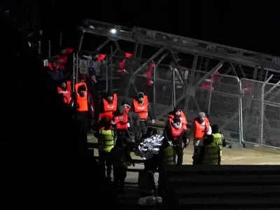 13 January 2024, United Kingdom, Dover: A group of people thought to be migrants are brought in to Dover, Kent, onboard a Border Force vessel following a small boat incident in the English Channel. Photo: Gareth Fuller/PA Wire/dpa