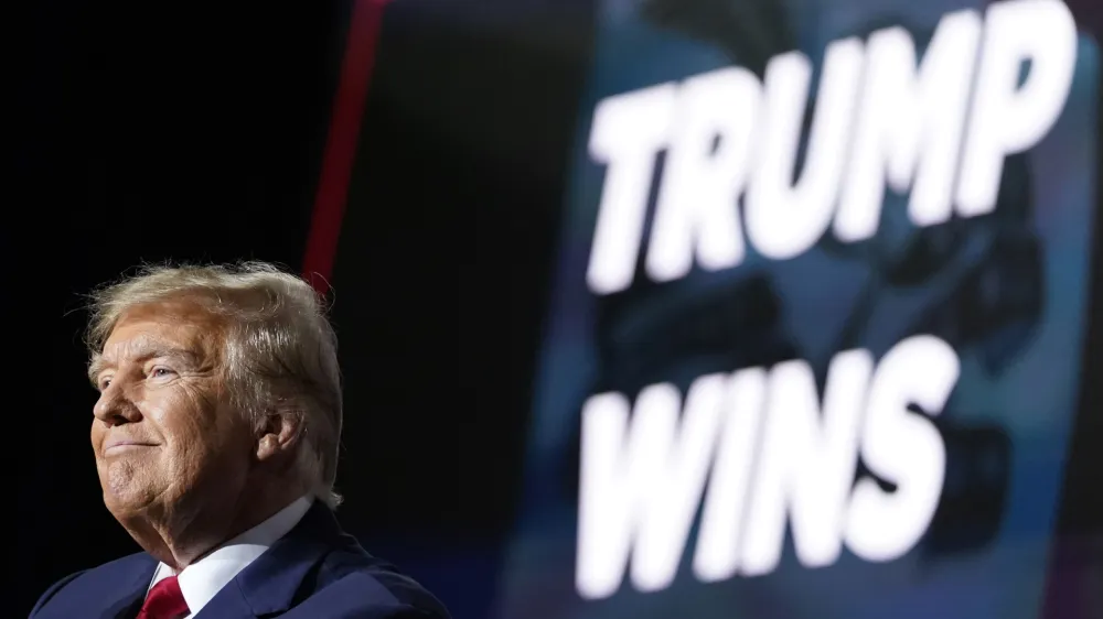 Republican presidential candidate former President Donald Trump speaks at a caucus night party in Des Moines, Iowa, Monday, Jan. 15, 2024. (AP Photo/Andrew Harnik)