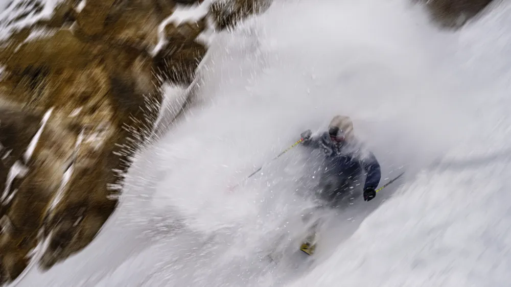 In this photo provided by the Mammoth Mountain Ski Area, a skier goes down a run in Mammoth Lakes, Calif., Monday, Jan. 22, 2024. (Christian Pondella/Mammoth Mountain Ski Area via AP)