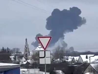 In this photo taken from validated UGC video smoke rises from the scene of a warplane crash at a residential area near Yablonovo, Belgorod region, Wednesday, Jun. 23, 2024. Russia says a military transport plane that was carrying 65 Ukrainian prisoners of war has crashed in a Russian region near Ukraine. (Validated UGC video via AP)