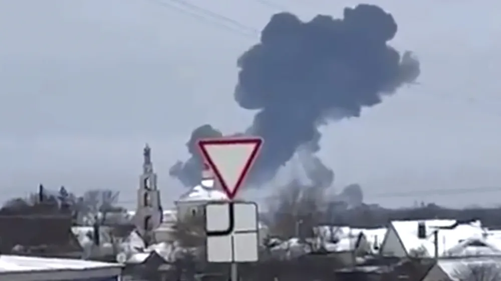 In this photo taken from validated UGC video smoke rises from the scene of a warplane crash at a residential area near Yablonovo, Belgorod region, Wednesday, Jun. 23, 2024. Russia says a military transport plane that was carrying 65 Ukrainian prisoners of war has crashed in a Russian region near Ukraine. (Validated UGC video via AP)