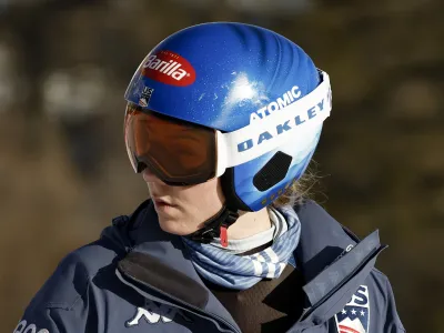 United States' Mikaela Shiffrin concentrates ahead of an alpine ski, women's World Cup downhill race, in Cortina d'Ampezzo, Italy, Friday, Jan. 26, 2024. Shiffrin crashed into the safety nets after losing control landing a jump during a World Cup downhill on Friday. (AP Photo/Gabriele Facciotti)