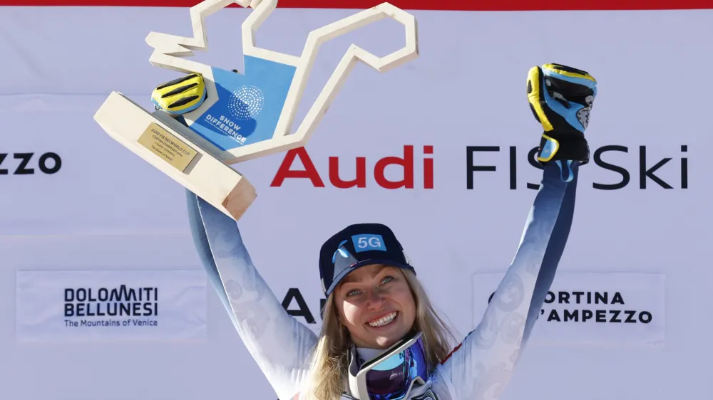 Norway's Ragnhild Mowinckel celebrates winning an alpine ski, women's World Cup downhill race, in Cortina d'Ampezzo, Italy, Saturday, Jan. 27, 2024. (AP Photo/Alessandro Trovati)