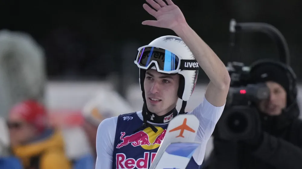 Timi Zajc, of Slovenia, reacts after his final round jump of the ski flying world championships, at the Kulmkogel mountain in Bad Mitterndorf, Austria, Saturday, Jan. 27, 2024. (AP Photo/Matthias Schrader)