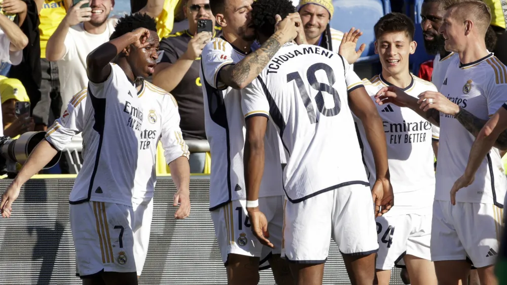Real Madrid's Aurelien Tchouameni celebrates scoring his side's second goal during a Spanish La liga soccer match between Las Palmas and Real Madrid at the Gran Canaria stadium on the Canary island of Las Palmas, Spain, Saturday, Jan. 27, 2024. (AP Photo/Gerardo Ojeda)