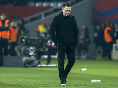 Barcelona's head coach Xavi Hernandez reacts during a Spanish La Liga soccer match between Barcelona and Villarreal at the Olimpic Lluis Companys stadium in Barcelona, Spain, Saturday, Jan. 27, 2024. Xavi says he won't continue as Barcelona's coach after this season. (AP Photo/Joan Monfort)