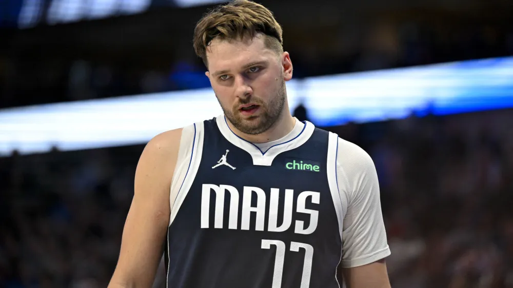 Jan 27, 2024; Dallas, Texas, USA; Dallas Mavericks guard Luka Doncic (77) walks back on to the court during the second quarter against the Sacramento Kings at the American Airlines Center. Mandatory Credit: Jerome Miron-USA TODAY Sports