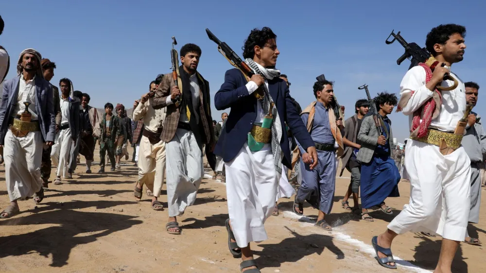 Armed Houthi followers march during a parade in solidarity with the Palestinians in the Gaza Strip and to show support to Houthi strikes on ships in the Red Sea and the Gulf of Aden, in Sanaa, Yemen January 29, 2024. REUTERS/Khaled Abdullah