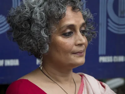 ﻿Writer activist Arundhati Roy sits for a press conference opposing the arrests this week of five prominent rights activists, in New Delhi, India, Thursday, Aug. 30, 2018. (AP Photo/Manish Swarup)