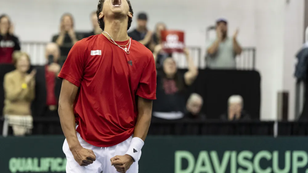 Gabriel Diallo of Canada celebrates his win over Kwon Soonwoo of South Korea during the first singles match of the Davis Cup tennis qualifiers in Montreal, Friday, Feb. 2, 2024. (Christinne Muschi/The Canadian Press via AP)