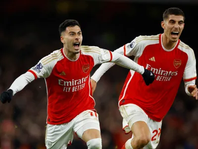 Soccer Football - Premier League - Arsenal v Liverpool - Emirates Stadium, London, Britain - February 4, 2024 Arsenal's Gabriel Martinelli celebrates scoring their second goal with Kai Havertz Action Images via Reuters/John Sibley NO USE WITH UNAUTHORIZED AUDIO, VIDEO, DATA, FIXTURE LISTS, CLUB/LEAGUE LOGOS OR 'LIVE' SERVICES. ONLINE IN-MATCH USE LIMITED TO 45 IMAGES, NO VIDEO EMULATION. NO USE IN BETTING, GAMES OR SINGLE CLUB/LEAGUE/PLAYER PUBLICATIONS.   TPX IMAGES OF THE DAY