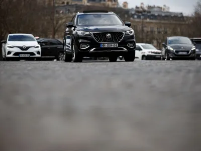 An SUV car drives on a street as Paris City Hall is to organise a public vote on SUV cars in the city, in Paris, France, February 2, 2024. REUTERS/Benoit Tessier