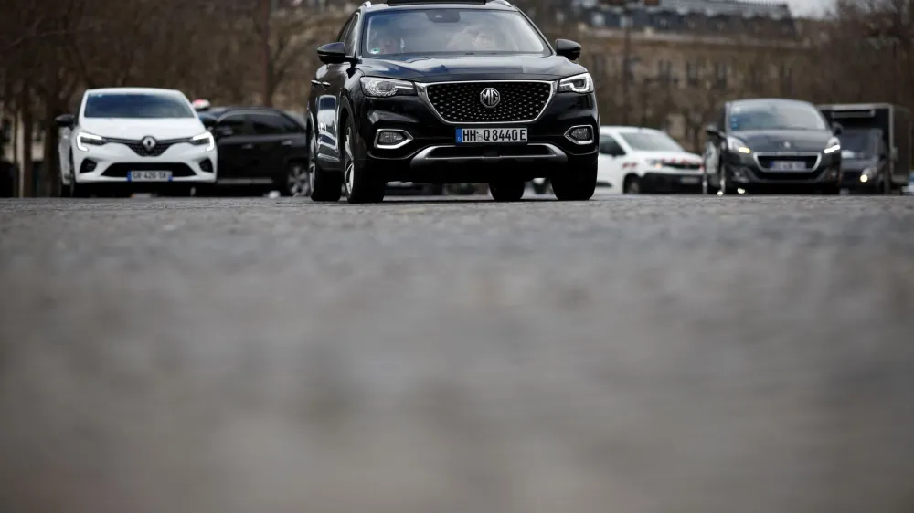 An SUV car drives on a street as Paris City Hall is to organise a public vote on SUV cars in the city, in Paris, France, February 2, 2024. REUTERS/Benoit Tessier
