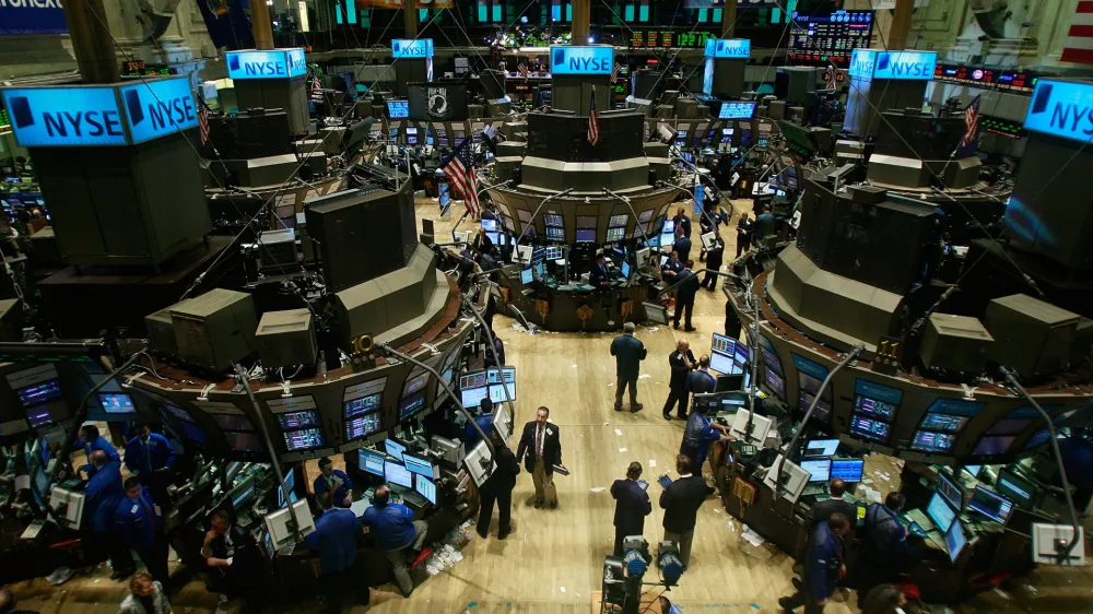 NEW YORK - FEBRUARY 20: Traders work on the floor of the New York Stock Exchange during afternoon trading February 20, 2009 in New York City. The Dow closed down 100 points to 7365.67 in a week that saw the Dow lose 6.1 percent. (Photo by Mario Tama/Getty Images)