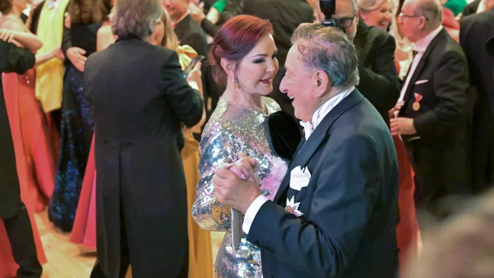 Priscilla Presley and Austrian entrepreneur Richard Lugner dance during the opening ceremony of the traditional Opera Ball in Vienna, Austria, February 8, 2024. REUTERS/Elisabeth Mandl