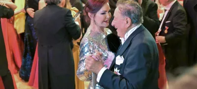 Priscilla Presley and Austrian entrepreneur Richard Lugner dance during the opening ceremony of the traditional Opera Ball in Vienna, Austria, February 8, 2024. REUTERS/Elisabeth Mandl