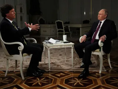 Russian President Vladimir Putin listens during an interview with U.S. television host Tucker Carlson in Moscow, Russia February 6, 2024. Sputnik/Gavriil Grigorov/Kremlin via REUTERS ATTENTION EDITORS - THIS IMAGE WAS PROVIDED BY A THIRD PARTY.