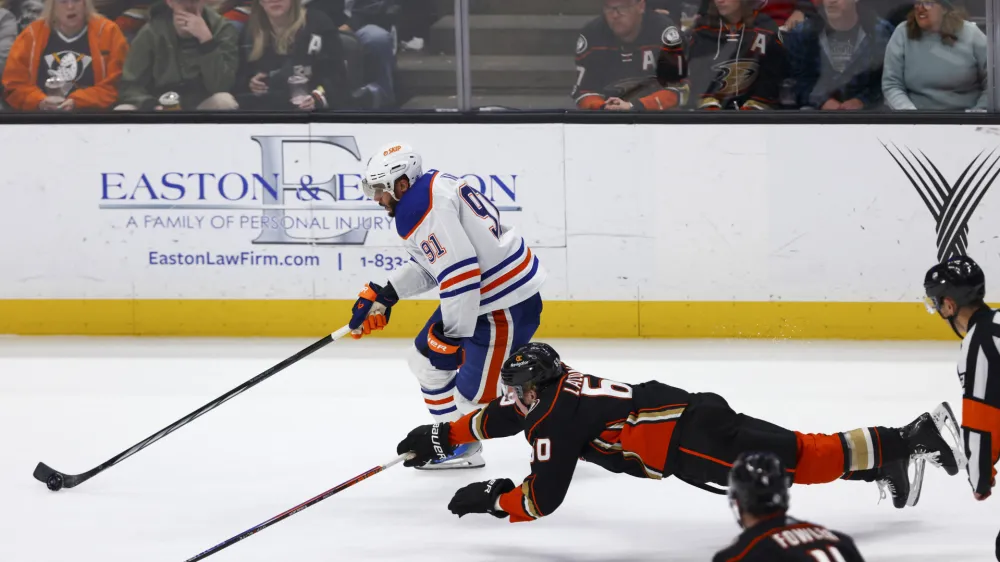 Feb 9, 2024; Anaheim, California, USA; Edmonton Oilers left wing Evander Kane (91) skates with the puck on a breakaway during the third period of a game against the Anaheim Ducks at Honda Center. Mandatory Credit: Jessica Alcheh-USA TODAY Sports
