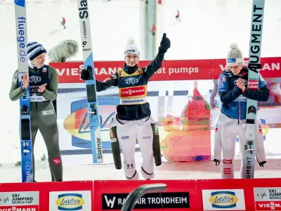 Winner Nika Prevc from Slovenia, centre, Eirin Maria Kvandal of Norway, who finished second at left and third placed Eva Pinkelnig from Austria, pose on the podium after the women's ski jumping, during the World Cup ski jumping at Gran&aring;sen in Trondheim, Norway, Wednesday, March 13, 2024. (Geir Olsen/NTB Scanpix via AP)