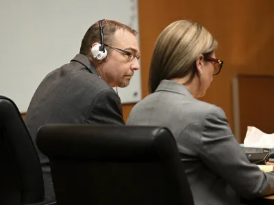 James Crumbley and his attorney Mariell Lehman listen to the verdict in Oakland County Court in Pontiac, Mich., Thursday, March 14, 2024. Crumbley, the father of a Michigan school shooter, was found guilty of involuntary manslaughter, a second conviction against the teen's parents who were accused of failing to secure a gun at home and doing nothing to address acute signs of his mental turmoil. (Robin Buckson/Detroit News via AP, Pool)