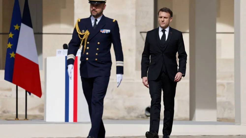 France's President Emmanuel Macron walks during a "national tribute" ceremony for late French politician and admiral, Philippe de Gaulle, son of Charles de Gaulle, at the Hotel des Invalides in Paris, France on March 20, 2024. LUDOVIC MARIN/Pool via REUTERS