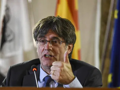 ADDS SECOND SENTENCE. <br>FILE - Catalan leader Carles Puigdemont speaks at a press conference in Alghero, Sardinia, Italy, Oct. 4, 2021. Puigdemont says that he will return to Spain for the first time since leading a failed 2017 breakaway bid if he has a viable chance to be restored as regional president following upcoming elections. Puigdemont is still a wanted man in Spain and hoping that a contentious amnesty bill that was crafted by Spain's left-wing government to clear him and hundreds of other supporters successfully makes it through the Madrid parliament in the coming months. (AP Photo/Gloria Calvi, File)