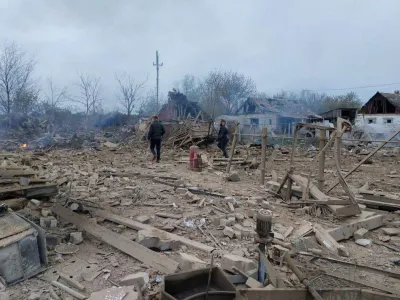 People are seen at the site of a residential area hit by a Russian military strike, amid Russia's attack on Ukraine, in the town of Pavlohrad, Dnipropetrovsk region, Ukraine May 1, 2023. Governor of Dnipropetrovsk Regional Military-Civil Administration Serhii Lysak via Telegram/Handout via REUTERS ATTENTION EDITORS - THIS IMAGE HAS BEEN SUPPLIED BY A THIRD PARTY. NO RESALES. NO ARCHIVES.