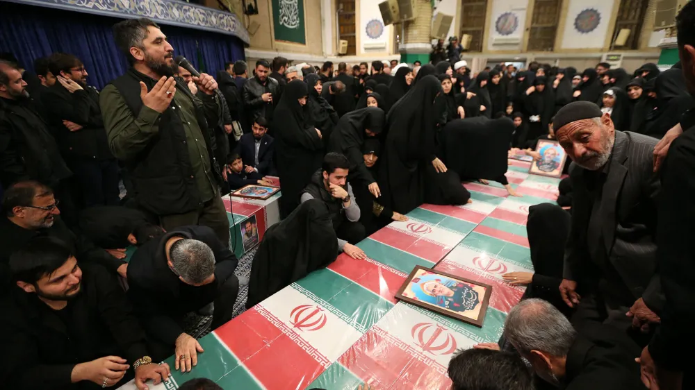 04 April 2024, Iran, Tehran: People&nbsp;mourn around the coffins of seven Revolutionary Guard Corps members who were killed in a strike on the country's consular in Damascus, which Tehran blamed on Israel, ahead of their funeral procession. Photo: -/Iranian Supreme leader's Office/dpa - ATTENTION: editorial use only and only if the credit mentioned above is referenced in full