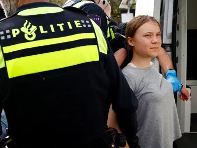 Swedish climate campaigner Greta Thunberg is detained by police, on the day climate activists try to block the A12 highway to ensure that the Dutch government stops subsidies for fossil fuels, in The Hague, Netherlands, April 6, 2024. REUTERS/Piroschka van de Wouw