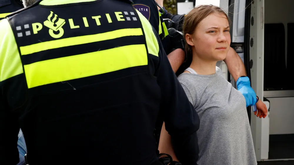 Swedish climate campaigner Greta Thunberg is detained by police, on the day climate activists try to block the A12 highway to ensure that the Dutch government stops subsidies for fossil fuels, in The Hague, Netherlands, April 6, 2024. REUTERS/Piroschka van de Wouw