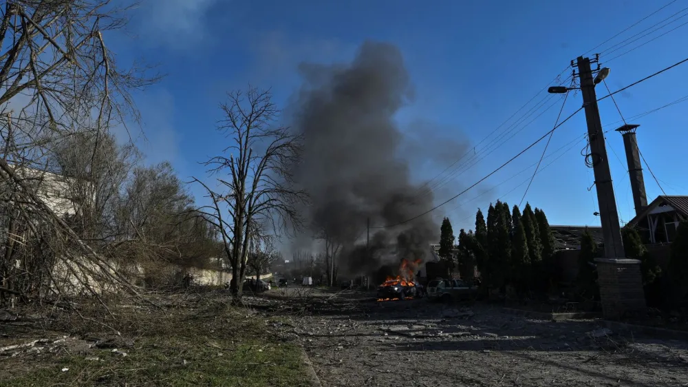 A car burns at a site of a Russian missile strike, amid Russia's attack on Ukraine, in Zaporizhzhia, Ukraine April 5, 2024. REUTERS/Stringer